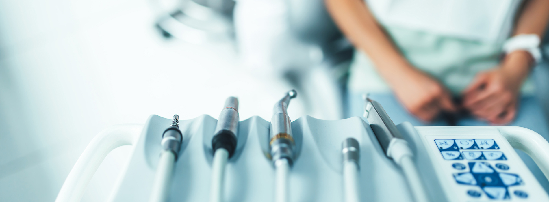 This is a composite image showing medical equipment and supplies, including a stethoscope, blood pressure cuff, tongue depressors, and other instruments, arranged in a manner that suggests they are part of a medical examination or procedure. The background is a solid color to emphasize the items.